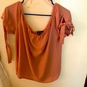 The blouse it’s color nude  it’s from ambiance is size XL